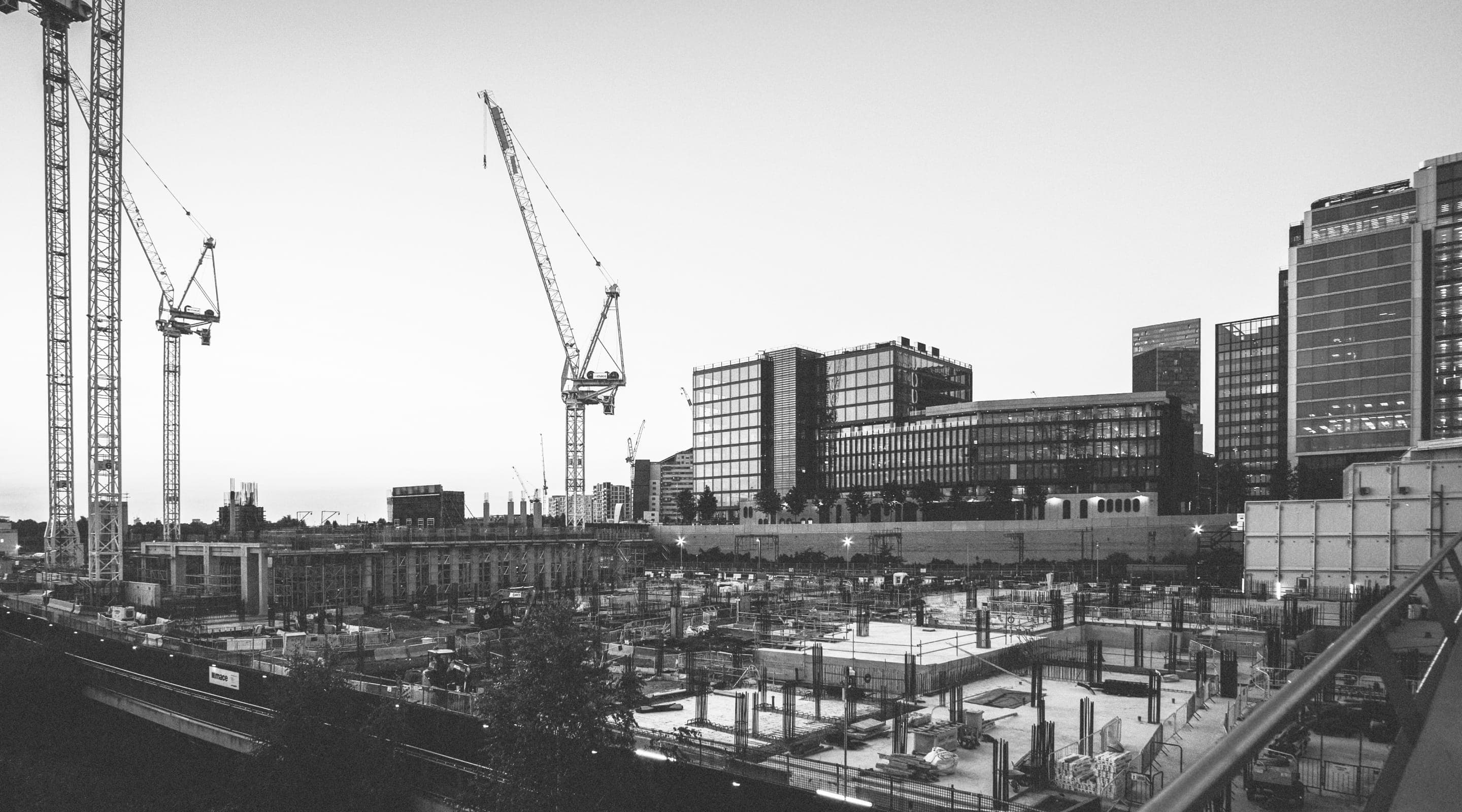 Wide construction site with crawler cranes