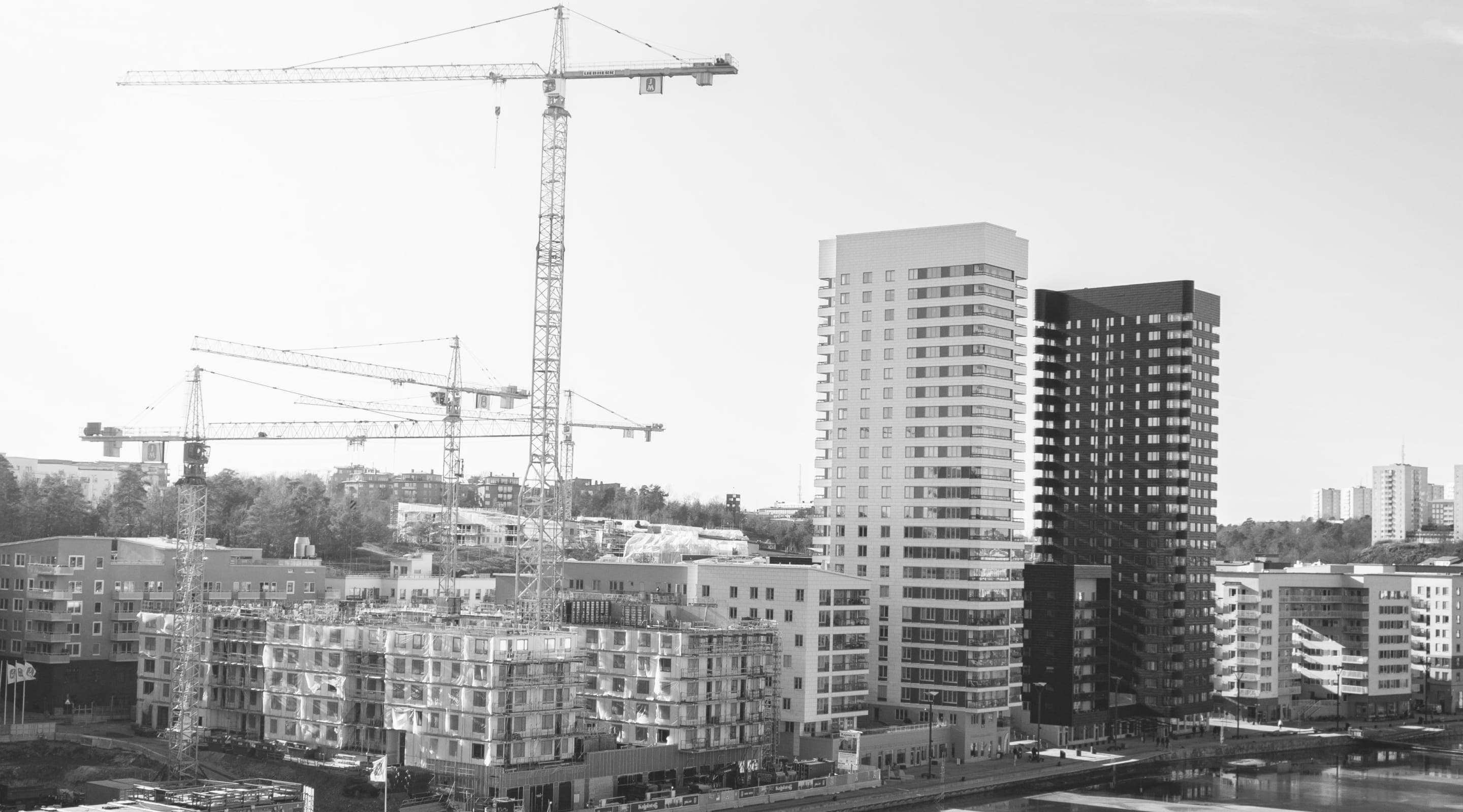 Urban construction site with tower cranes